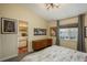 Bedroom and ensuite bathroom featuring artwork and updated fixtures for style and convenience at 3096 W Prentice Ave # G, Littleton, CO 80123