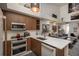Modern kitchen featuring sleek countertops, stainless steel appliances, and stylish cabinetry creating a chef-inspired culinary space at 3096 W Prentice Ave # G, Littleton, CO 80123
