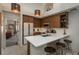 Contemporary kitchen with island seating, premium appliances, and a seamless connection to the living area for modern living at 3096 W Prentice Ave # G, Littleton, CO 80123