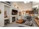 Open living space with fireplace, large TV, and seamless flow to the kitchen creating an inviting atmosphere for modern living at 3096 W Prentice Ave # G, Littleton, CO 80123