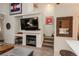 Cozy living room with fireplace and built-in shelving and decor for comfortable living at 3096 W Prentice Ave # G, Littleton, CO 80123