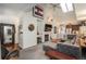Bright living room features a fireplace, vaulted ceilings, and skylights for an open and airy feel at 3096 W Prentice Ave # G, Littleton, CO 80123
