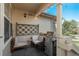 Cozy porch featuring comfortable seating, a barbecue grill, and decorative string lights for outdoor relaxation and entertaining at 3096 W Prentice Ave # G, Littleton, CO 80123