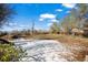 A spacious backyard partially covered with snow and a slide at 10280 W 8Th Ave, Lakewood, CO 80215