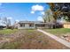 Charming single-story home with a well-maintained front yard and a welcoming pathway at 10280 W 8Th Ave, Lakewood, CO 80215