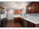 Well-lit kitchen featuring stainless steel appliances, ample counter space, and modern fixtures at 10280 W 8Th Ave, Lakewood, CO 80215