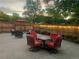 Inviting backyard with patio furniture, string lights on a wood fence, and mature trees at 4057 Bryant St, Denver, CO 80211