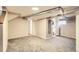 Spacious basement area with neutral carpet, a full bathroom, and ample potential at 4057 Bryant St, Denver, CO 80211