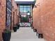 Outdoor space shows exterior brick buildings with large windows and sidewalk seating at 4057 Bryant St, Denver, CO 80211