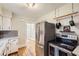 Modern kitchen with stainless steel appliances and a view into the other rooms at 4057 Bryant St, Denver, CO 80211