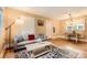 Cozy living room with hardwood floors and large window at 4057 Bryant St, Denver, CO 80211