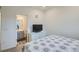 Bedroom features a light gray dresser with modern handles and an ensuite bathroom at 8376 Lorenzo Ln # C, Littleton, CO 80129