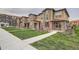 Well-manicured lawns enhance the appeal of these inviting townhomes at 8376 Lorenzo Ln # C, Littleton, CO 80129