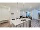 Spacious kitchen with island seating, stainless appliances and open floor plan at 8376 Lorenzo Ln # C, Littleton, CO 80129