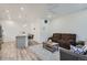 Open-concept living space with modern lighting and stylish decor at 8376 Lorenzo Ln # C, Littleton, CO 80129