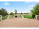 Inviting backyard deck with a seating area, fireplace and beautiful views of the open yard at 10170 E 151St Ct, Brighton, CO 80602