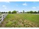 Expansive backyard enclosed by a white fence, perfect for outdoor activities at 10170 E 151St Ct, Brighton, CO 80602