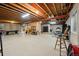Unfinished basement with exposed ceiling and beams, and ample space for customization at 10170 E 151St Ct, Brighton, CO 80602