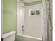 Bathroom featuring a white tiled shower and tub, and a shower curtain at 10170 E 151St Ct, Brighton, CO 80602