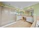 Spacious bathroom with dual sinks, a large mirror, and a separate shower at 10170 E 151St Ct, Brighton, CO 80602