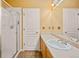 Bright bathroom featuring a single sink vanity, enclosed shower, and neutral color scheme at 10170 E 151St Ct, Brighton, CO 80602