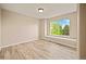 Inviting bedroom with wood-look floors, a window seat, and plenty of natural light at 10170 E 151St Ct, Brighton, CO 80602