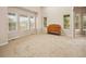 Sunlit bedroom featuring multiple windows, plush carpeting, and a classic dresser at 10170 E 151St Ct, Brighton, CO 80602