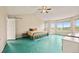 Spacious bedroom boasts vaulted ceilings, a large window, and a colorful accent rug at 10170 E 151St Ct, Brighton, CO 80602
