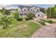 Charming two-story home with a covered porch and lush landscaping at 10170 E 151St Ct, Brighton, CO 80602