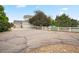 Charming home featuring a white picket fence and an attached three-car garage, set in a well-maintained neighborhood at 10170 E 151St Ct, Brighton, CO 80602