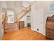 Inviting foyer with hardwood floors, a staircase, and natural light creating a warm welcome at 10170 E 151St Ct, Brighton, CO 80602