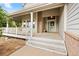 Inviting front porch featuring a covered entrance, brick accents, and ample space at 10170 E 151St Ct, Brighton, CO 80602