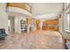 Expansive living room with an open layout, seamlessly connecting to the kitchen and dining areas at 10170 E 151St Ct, Brighton, CO 80602