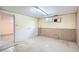 Unfinished basement with concrete floor and utilitarian walls provides ample space for storage or customization at 8122 W Woodard Dr, Lakewood, CO 80227