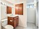 Bathroom with vanity, mirror, medicine cabinet and a clean, well-maintained toilet at 8122 W Woodard Dr, Lakewood, CO 80227