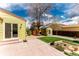 Backyard featuring patio, shed, lawn, and mature tree with playhouse at 2348 Sherman St, Longmont, CO 80501