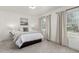 Relaxing bedroom featuring neutral tones, soft carpet, and windows providing ample natural light at 2348 Sherman St, Longmont, CO 80501