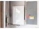 Image of solar panel components, including the TESLA battery and electrical panel at 2348 Sherman St, Longmont, CO 80501