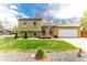 Charming exterior of a two-story home with a well-manicured lawn and attached garage at 2348 Sherman St, Longmont, CO 80501