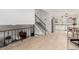 Spacious living room with stairs leading to upper level, an open concept, and light wood floors at 2348 Sherman St, Longmont, CO 80501