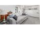 Cozy living room with plush gray sofa, soft carpeting, and easy access to the laundry area at 2348 Sherman St, Longmont, CO 80501