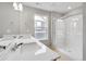 Modern bathroom features dual sinks with a spacious countertop and a glass-enclosed shower at 14239 Beebalm Ave, Parker, CO 80134
