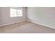Neutral bedroom featuring a carpeted floor, window, and neutral colored walls at 14239 Beebalm Ave, Parker, CO 80134