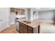 This kitchen island has a granite countertop, stainless steel dishwasher and a double sink at 14239 Beebalm Ave, Parker, CO 80134