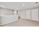 Upstairs loft featuring neutral paint, carpet, and multiple white doors at 14239 Beebalm Ave, Parker, CO 80134