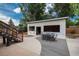 Backyard showcasing outdoor entertainment space and stairs to deck area at 772 Lewiston St, Aurora, CO 80011