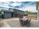 Backyard with deck, outdoor dining set, two story house, and storage shed at 772 Lewiston St, Aurora, CO 80011