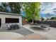 Open backyard area featuring a entertainment space with outdoor seating and trampoline at 772 Lewiston St, Aurora, CO 80011