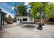 Backyard showcasing a trampoline, basketball hoop, and outdoor entertainment space at 772 Lewiston St, Aurora, CO 80011