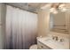 Cozy bathroom with white vanity, quartz countertop, and classic framed mirror at 772 Lewiston St, Aurora, CO 80011